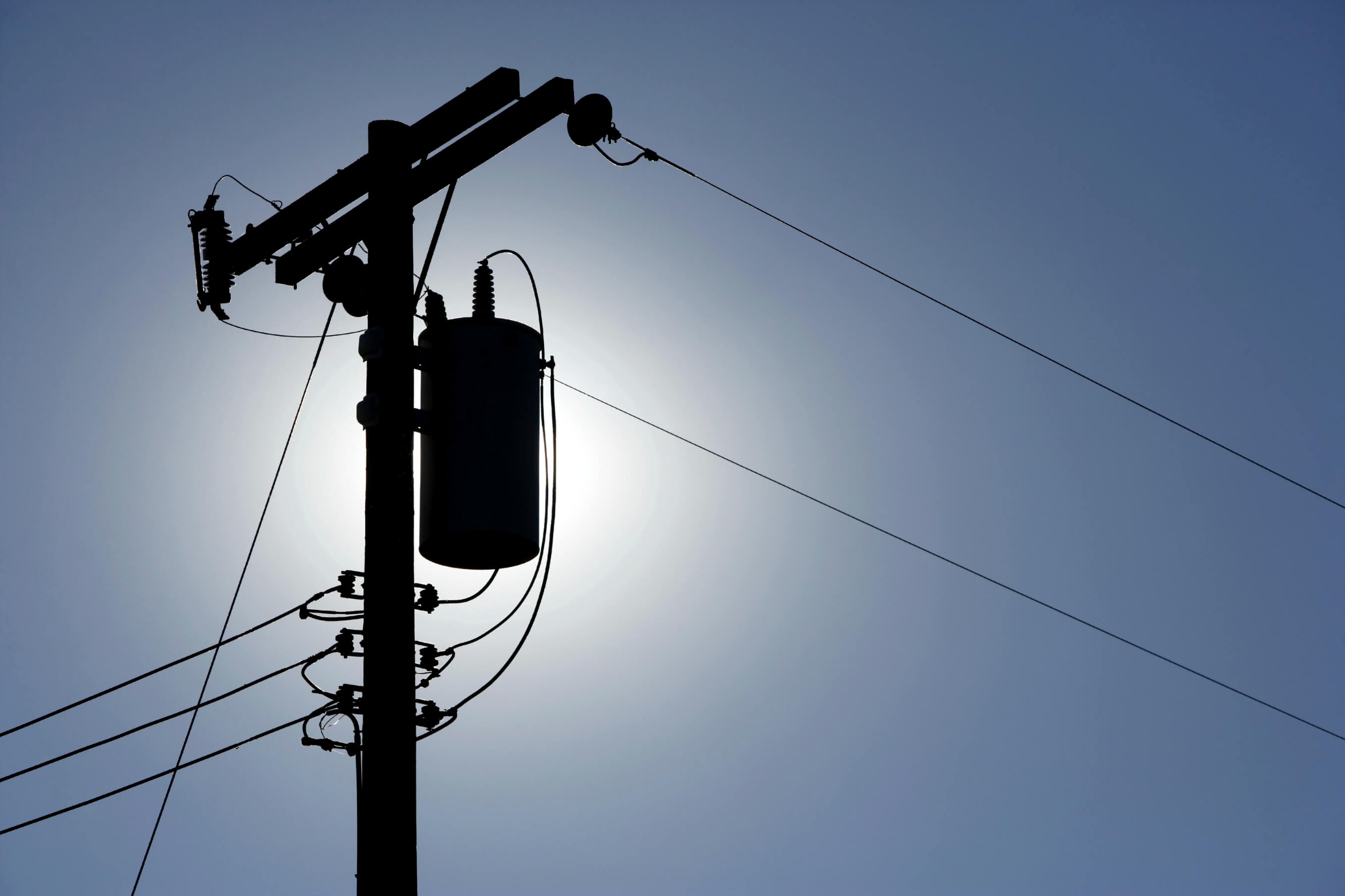 Custom pole line hardware on a communications pole